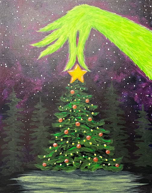 A green furry hand places a star on top of a decorated Christmas tree against a starry night sky.