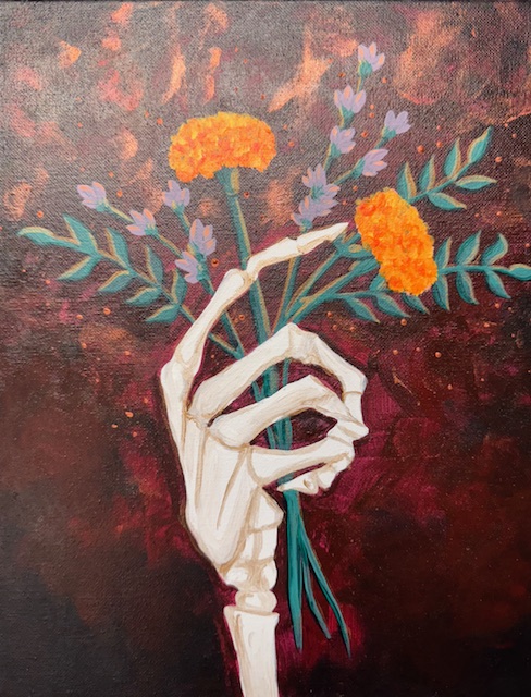 A skeletal hand holds a small bouquet of orange marigolds and purple flowers against a dark, reddish-brown background—perfect inspiration for your next Guided Mutiny Painting Event.