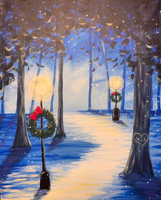 A snowy path through tall trees, illuminated by lampposts decorated with holiday wreaths and red bows, sets the scene for a magical Light The Way painting event beneath a blue evening sky.